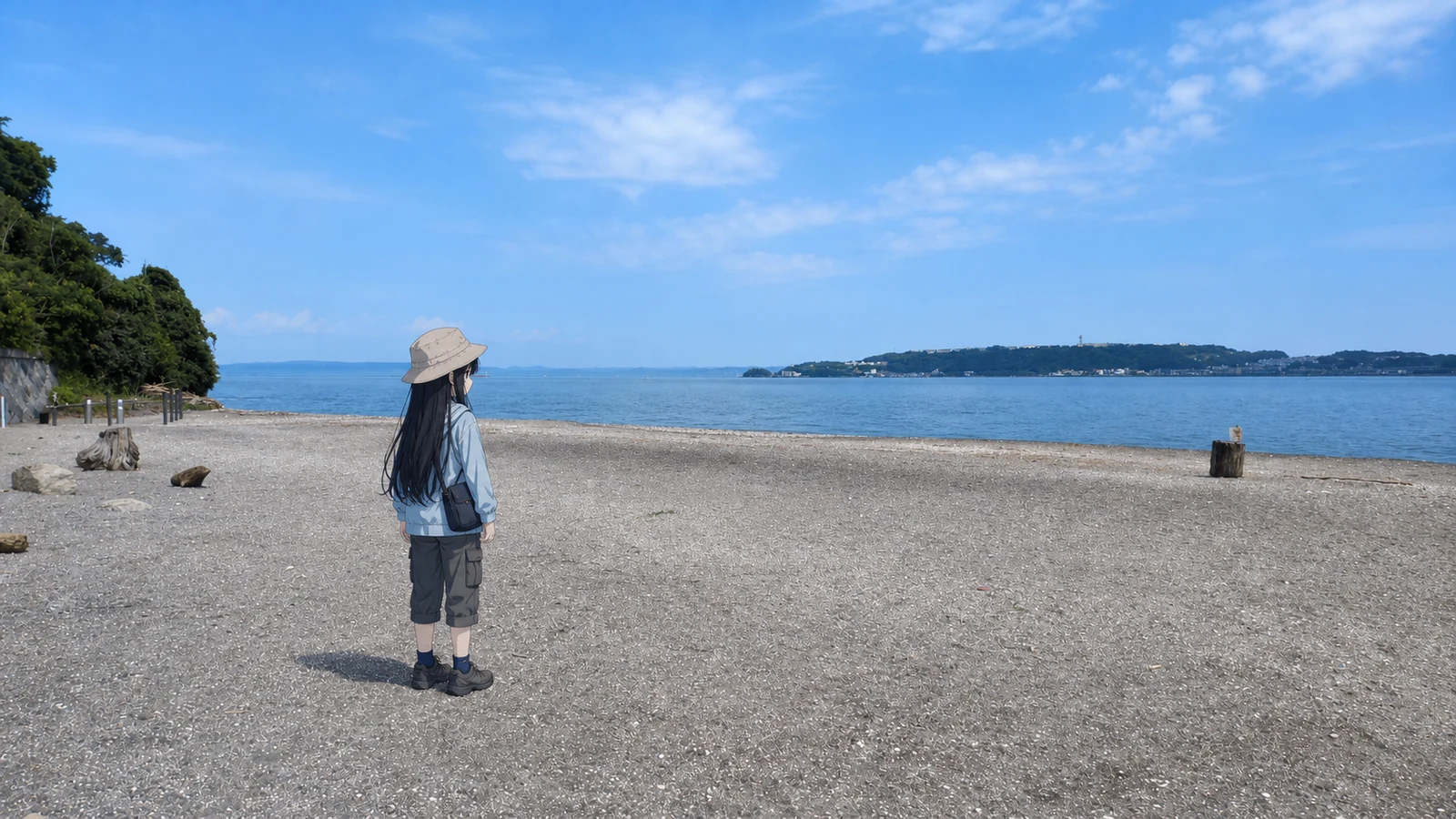猿島の誰もいない砂浜で、波打ち際を歩く凜